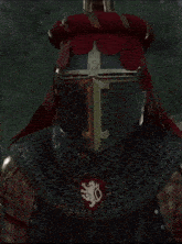 a knight drinking from a wooden mug with a lion on it