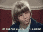 a young boy is sitting in a chair with the words `` me purchasing eau de la urine '' written above him .