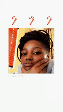a picture of a woman with candy canes in the background and the date 20.12.2020