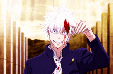 a man with blood on his face is smiling
