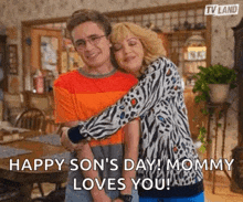 a man and a woman are hugging each other in a room .