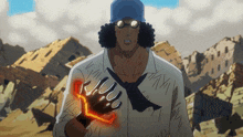 a man in a blue hat and glasses holds a glove that says ' xii ' on it
