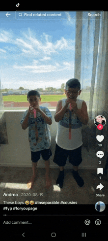 two young boys are playing with toys in front of a window on tiktok .