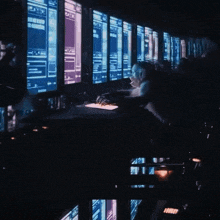a person is typing on a keyboard with the letters i j and k visible