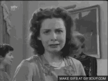 a black and white photo of a woman with a cat ear on her head