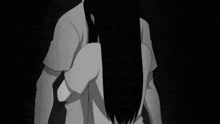 a black and white photo of a person covering their face with their hands .