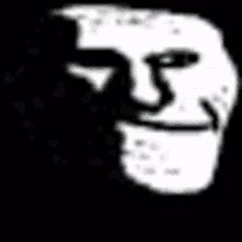 a black and white photo of a troll face with a skull and teeth .