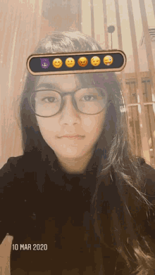 a girl wearing glasses with smiley faces on her face and the date 10 mar 2020