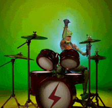 a man is playing drums with a lightning bolt on the drum set