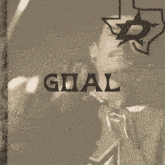 a goal sign with a man in a green jersey