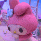 a pink hello kitty says " won 't you " in a netflix advertisement