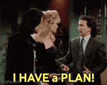 a man in a suit says " i have a plan " while standing next to a woman