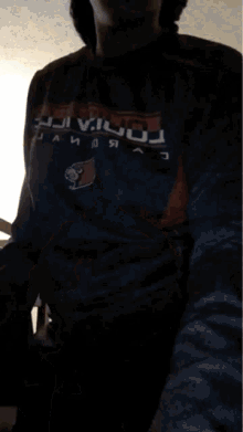 a person wearing a sweatshirt with the word barcelona on it