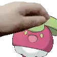 a person is petting a pink cartoon character with a green hat .