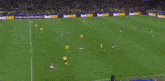 a soccer field with fedex ads on the side