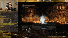 a man playing dark souls ii on a computer