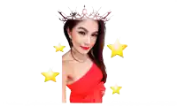 a woman in a red dress is wearing a crown and smiling