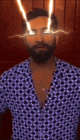 a man with a beard wearing a purple shirt has lightning bolts coming out of his eyes
