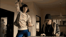 a man and a woman are playing a game together