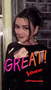 a woman in a black shirt with the words great voice written on it