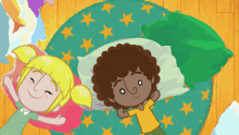 a boy and a girl are laying on the floor with pillows