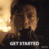 a man holding a gun with the words get started written on the bottom