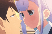 a man and a girl are looking at each other and the girl has blue eyes