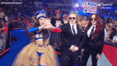 a sign that says i pledge allegiance to chelsea is in front of a crowd of people