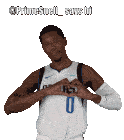a basketball player with the number 0 on his jersey making a heart shape