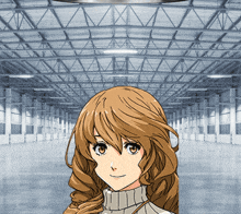 a woman in a sweater is standing in a large warehouse