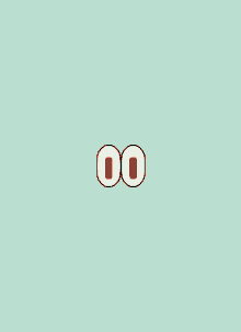 two green carrots on a red background that looks like eyes