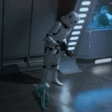 a storm trooper is standing in a room with a gun