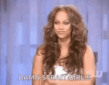 a woman with long hair is sitting on a chair and says `` damn strait girl ! ''
