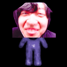 a blurry picture of a person 's face with a purple object in front of it