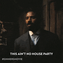 a man in a suit and tie says this ain 't no house party