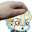 a person is putting a cookie on top of a cartoon character .