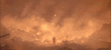 a man is standing in the middle of a large fire