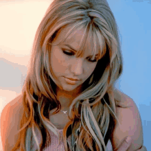 a close up of a woman 's face with blonde hair