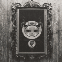 a black and white painting of a monster with fangs