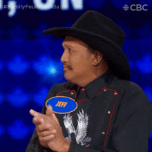 a man wearing a cowboy hat and a shirt that says jeff on it