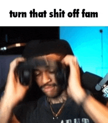 a man wearing headphones is making a funny face .