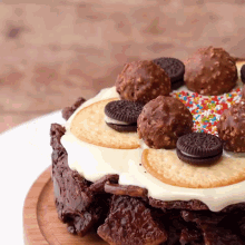 a chocolate cake with oreos and ferrero rocher