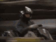 a blurred image of a person standing next to a wall
