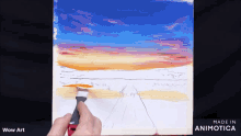 a person is painting a sunset on a canvas with wow art on the bottom