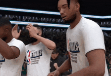 a basketball player wearing a finals t-shirt high fives another player
