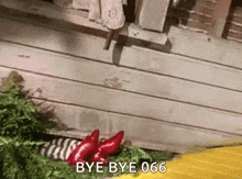 a gif of a person saying bye bye 666 in front of a wooden building