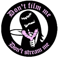 a sticker that says ' don 't film me ' and ' don 't stream me '