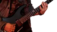 a man is playing a guitar with a letter k on the neck