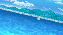 a large body of water with mountains in the background and a city in the foreground