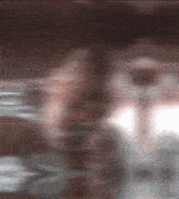 a blurred image of a person 's face with a white border